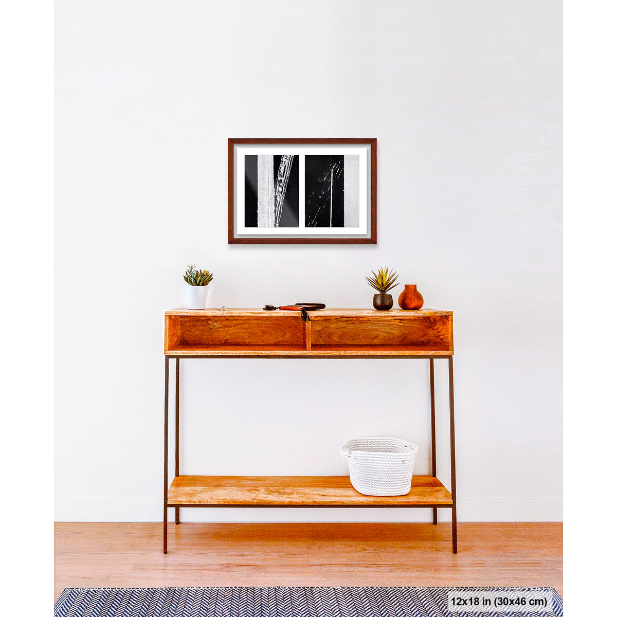 Uncontrolled White artwork by Susan Bowen, shown as 12x18 framed print. Features skewed white road stripes and tire marks capture the tension between order and accident on asphalt.