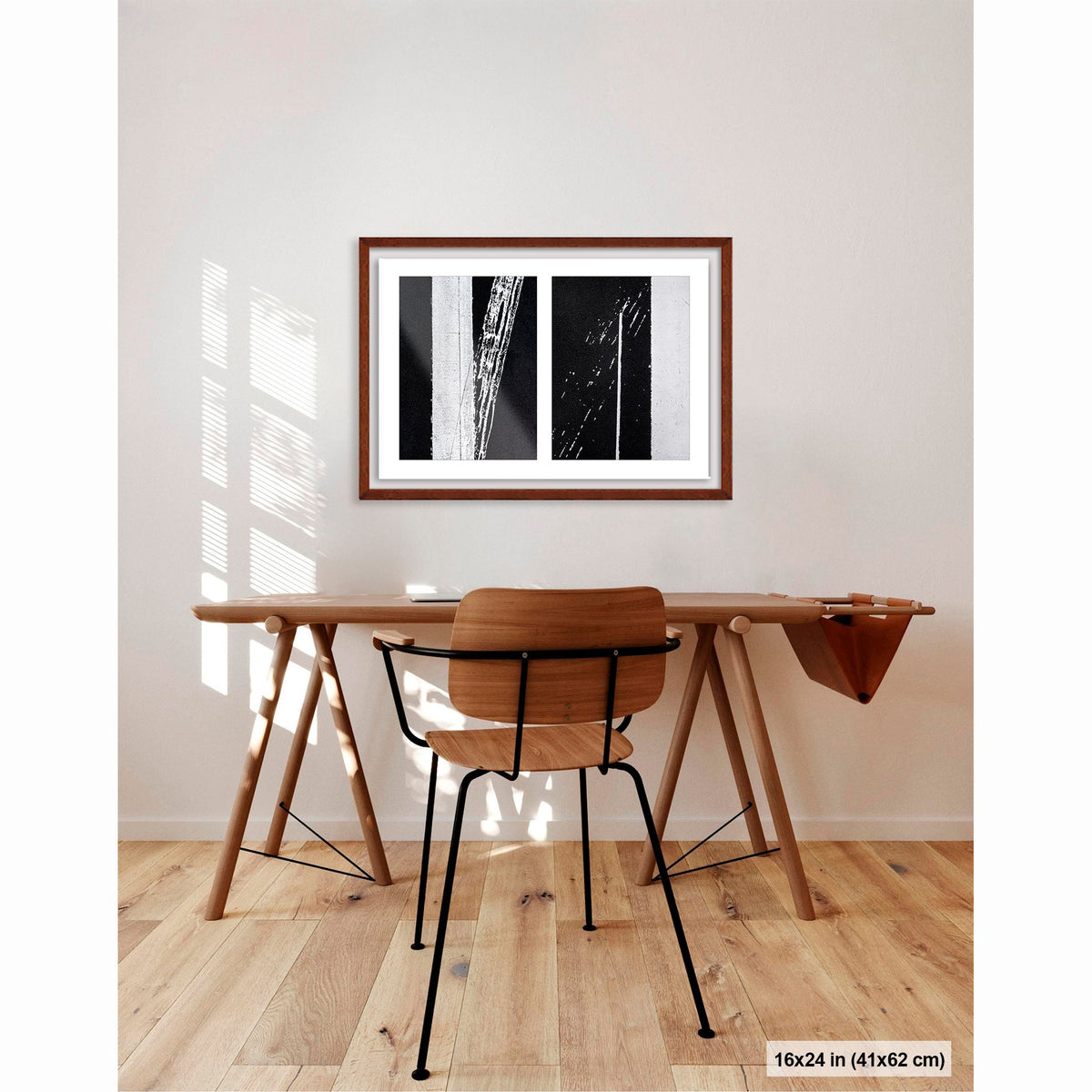 Uncontrolled White artwork by Susan Bowen, shown as 16x24 framed print. Features skewed white road stripes and tire marks capture the tension between order and accident on asphalt.