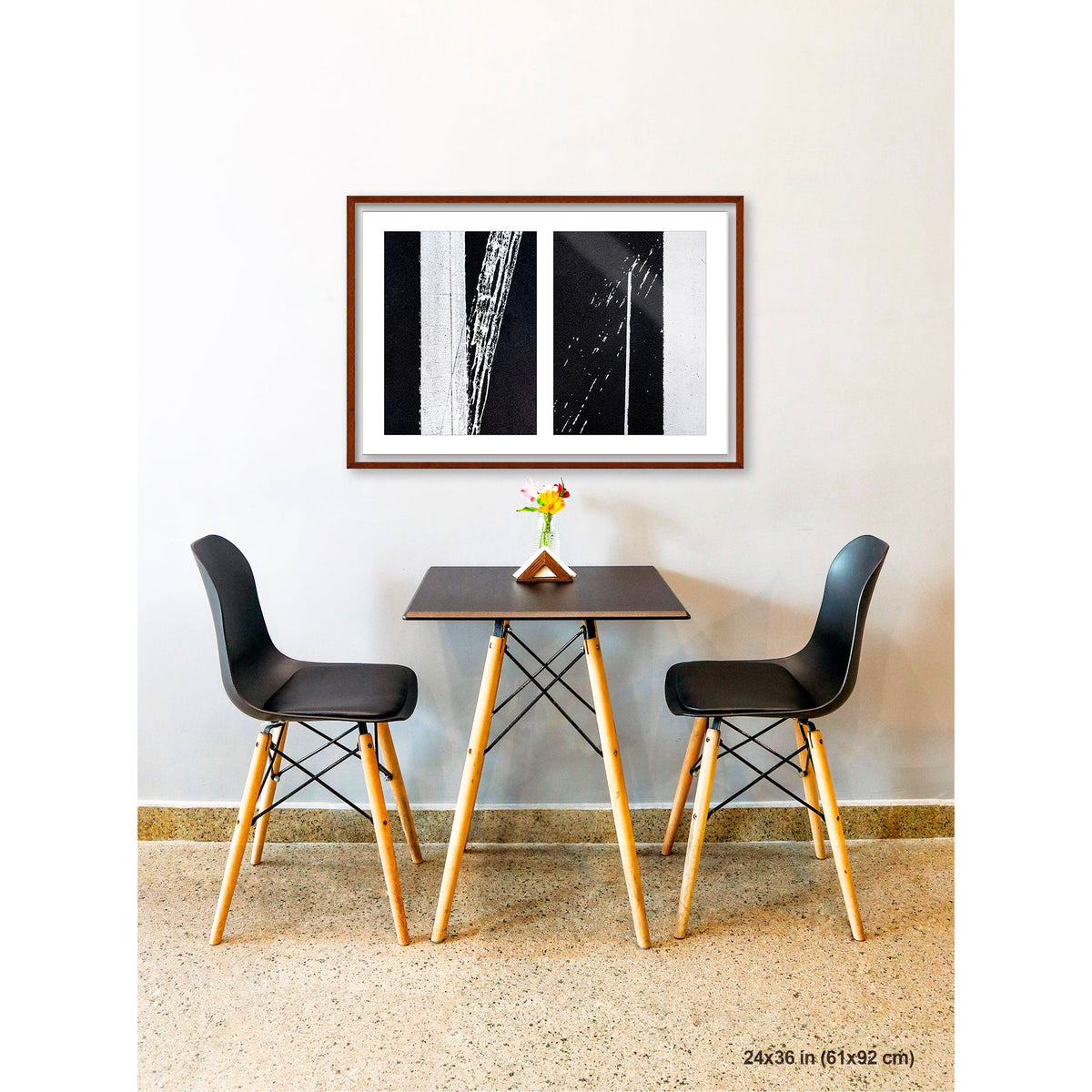 Uncontrolled White artwork by Susan Bowen, shown as 24x36 framed print. Features skewed white road stripes and tire marks capture the tension between order and accident on asphalt.