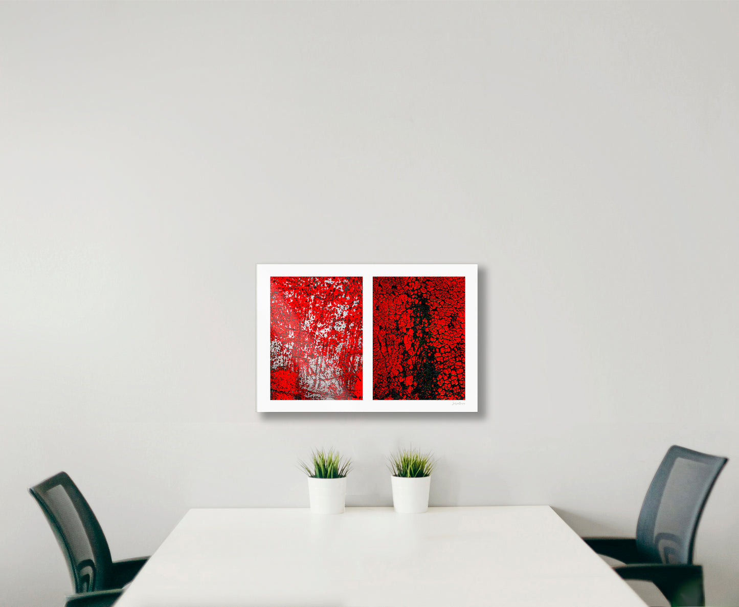 Abstract photographic diptych of highly textured surfaces in red, black, and white.  Example of small size in acrylic in an office setting.