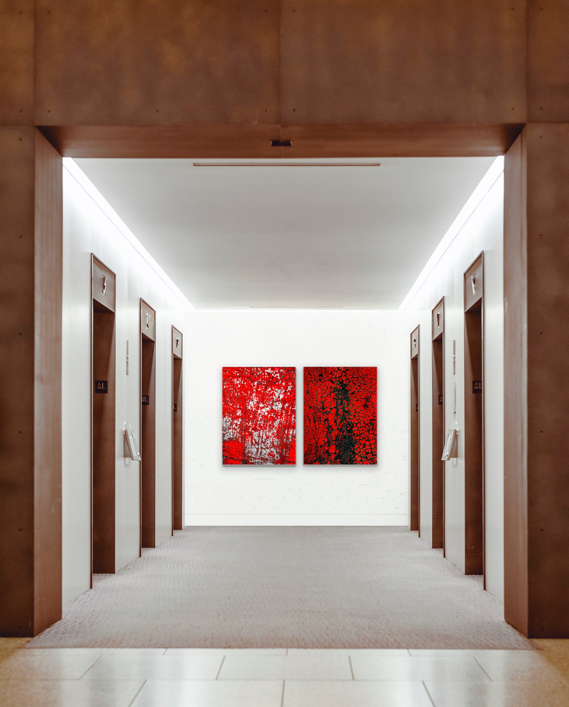 Abstract photographic diptych of highly textured surfaces in red, black, and white.  Example of multi-panel acrylic piece in a hotel setting.