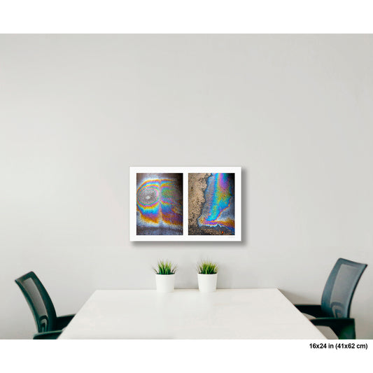 Oil Spill Pair artwork by Susan Bowen, shown as 16x24 print. Features iridescent oil spills on wet asphalt photographed as vivid abstract diptych, cycling through rainbow hues of blue, gold, and violet.