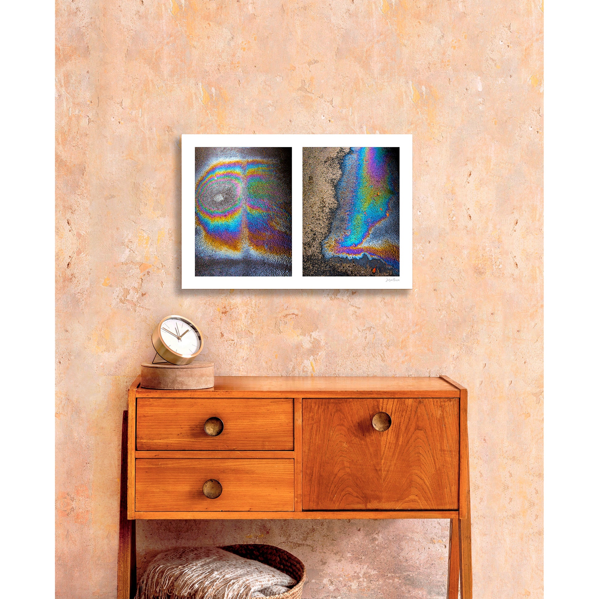 A diptych of two abstract photographs of oil spills on an asphalt surface, with vibrant multicolored patterns.