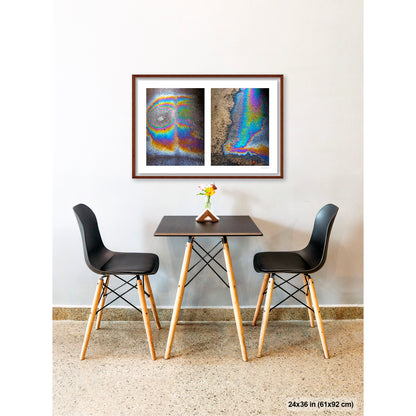Oil Spill Pair artwork by Susan Bowen, shown as 24x36 framed print. Features iridescent oil spills on wet asphalt photographed as vivid abstract diptych, cycling through rainbow hues of blue, gold, and violet.