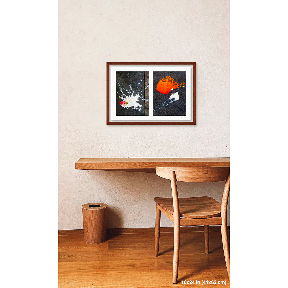 Dropped Cream and Orange Glob artwork by Susan Bowen, shown as 16x24 framed print. Features abstract diptych pairing a radiant white splatter with a bold orange paint spill on city pavement, two accidental forms in vivid contrast.